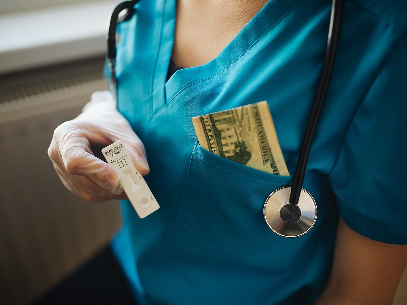 A healthcare worker in scrubs